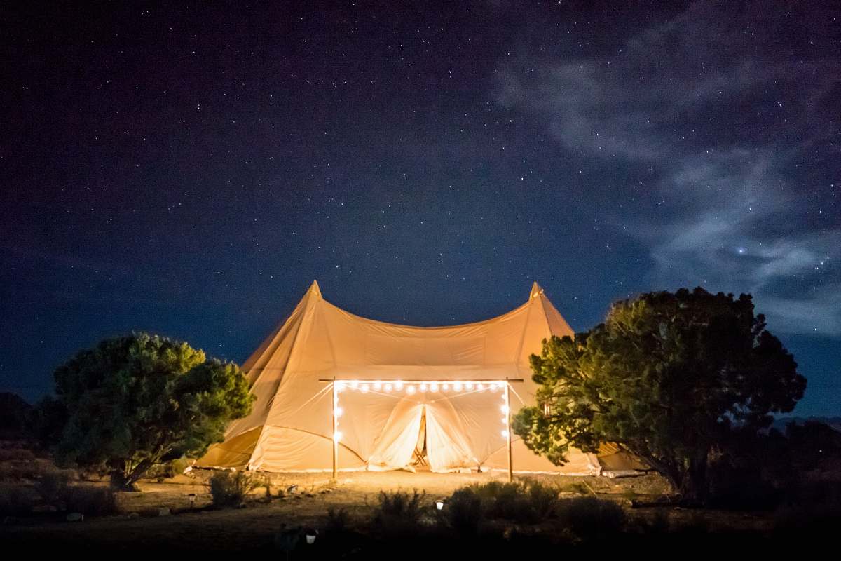night sky beige tent under starry skies camping